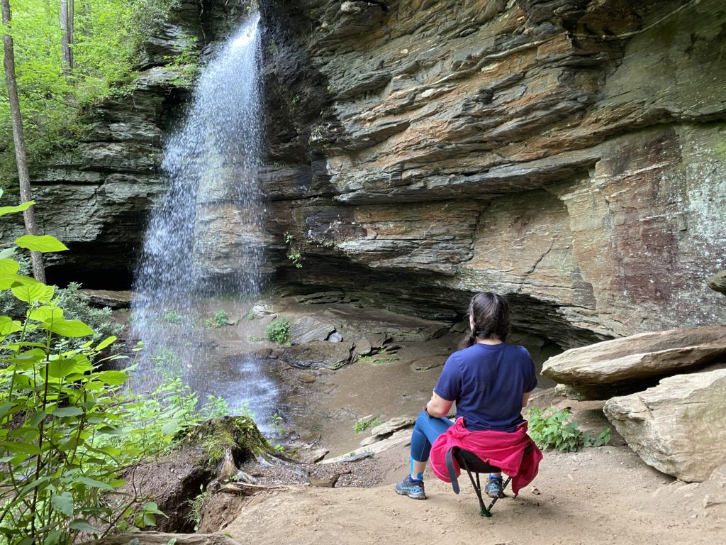 Enjoying lunch at a NC waterfall with the help of my Clever Stick in seat form.